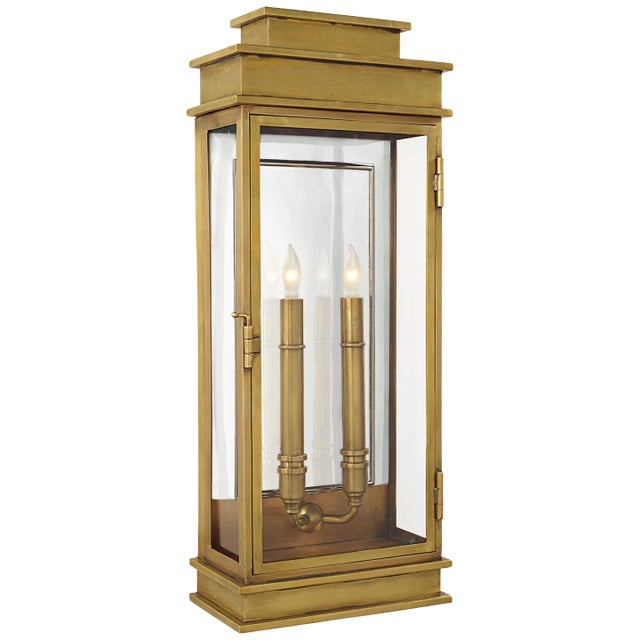 Linear Lantern Tall in Antique-Burnished Brass Designer: Chapman & Myers Height: 22.5" Extension: 5" Backplate: 9" x 20"...