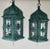 Elegant and full of character, this pair of hanging lanterns showcases intricate metal filigree design with a richly aged...