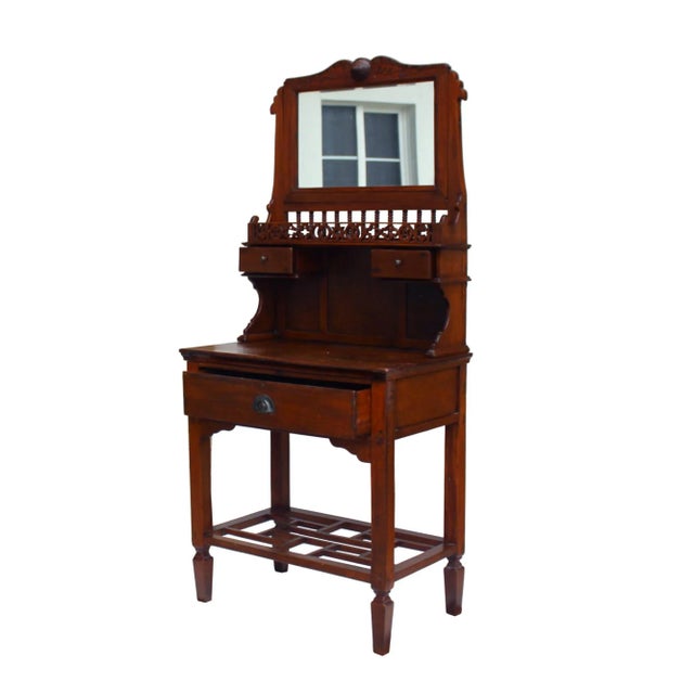 This is a Chinese decorative vintage wood washbowl basin stand. It is in a rectangular shape base with storage and a...