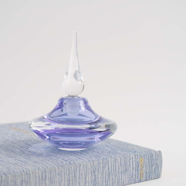 Delicate light lavender glass perfume bottle with a crystal-clear stopper signed "Vandermark SPO9N" and dating to the...