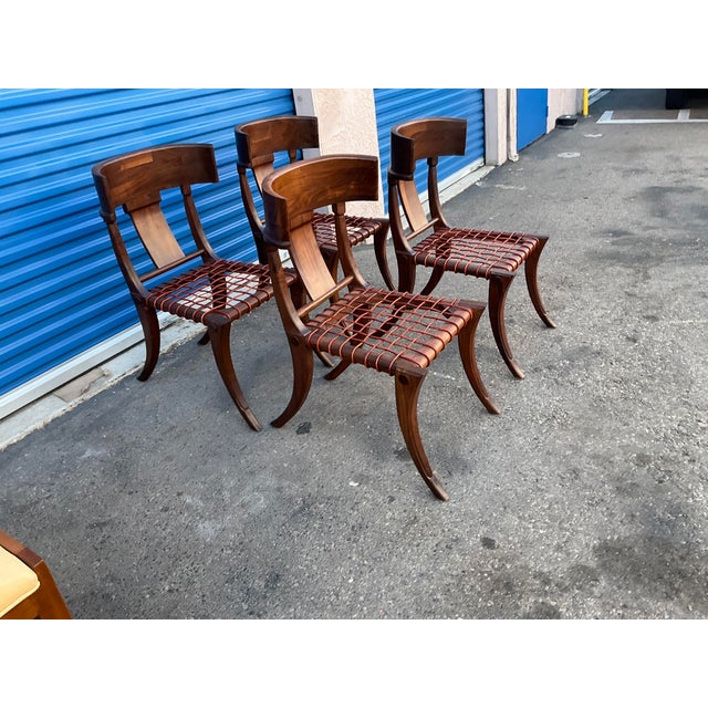 Klismos modern walnut chairs, set of 4 Chairs are made of solid walnut and have a natural walnut finish. Chairs are in...