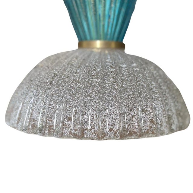 A refined pair of Italian Murano glass table lamps, crafted circa the 1980s, showcasing traditional Venetian glassmaking...