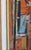 Vibrant Painting of a Figure Painting on an Easel Outside in a Gardenscape With a Brick Building in the Background For Sale In Reno/Lake Tahoe - Image 6 of 8