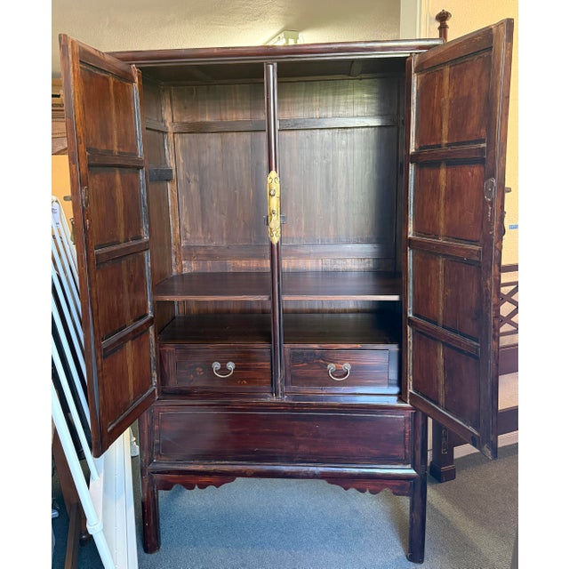 Design Plus Gallery presents a Wedding Armoire from North Peking. This armoire offers excellence in dark brown lacquer....