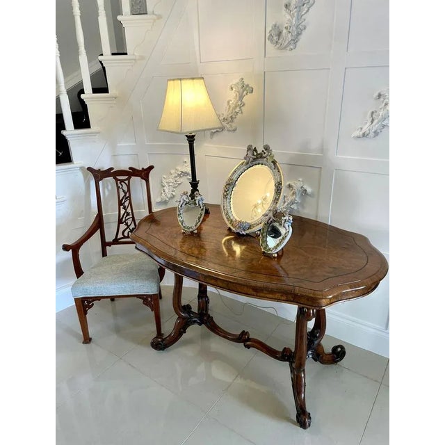 Large antique continental porcelain easel mirror with an oval mirror plate and foliate decorated edge surmounted by two...