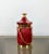 Ice bucket by the Italian designer Aldo Tura (original label still attached - Tura Creazioni) in red goatskin and brass...