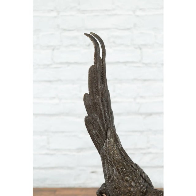 Metal Contemporary Bronze Statue of a Parrot Perched on a Branch and Leaning Down, with Dark Patina For Sale - Image 7 of 13