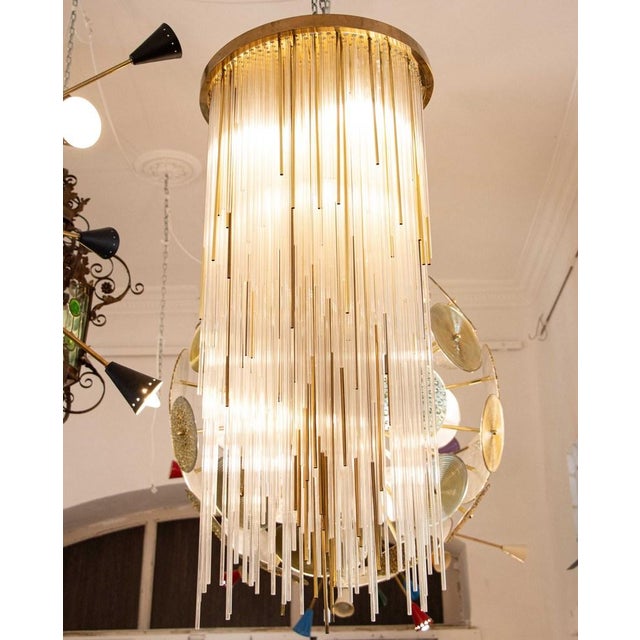 A stunning ceiling lamp with cylindrical Murano glass rods. Italian design, Mid-Century. This ceiling lamp features a...