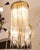 A stunning ceiling lamp with cylindrical Murano glass rods. Italian design, Mid-Century. This ceiling lamp features a...