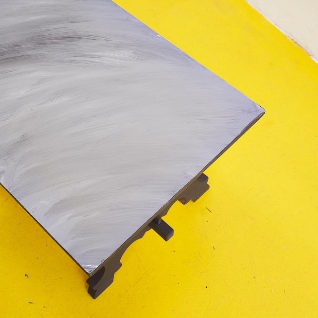 Discover this refined work of art, a designer table that combines elegance and functionality. The matte gray finish stands...