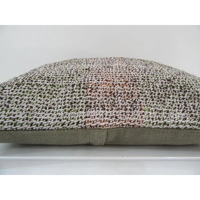 This is a pillow cover made from a vintage kilim rug. The piece was properly washed and ready to use. Pillow inserts not...