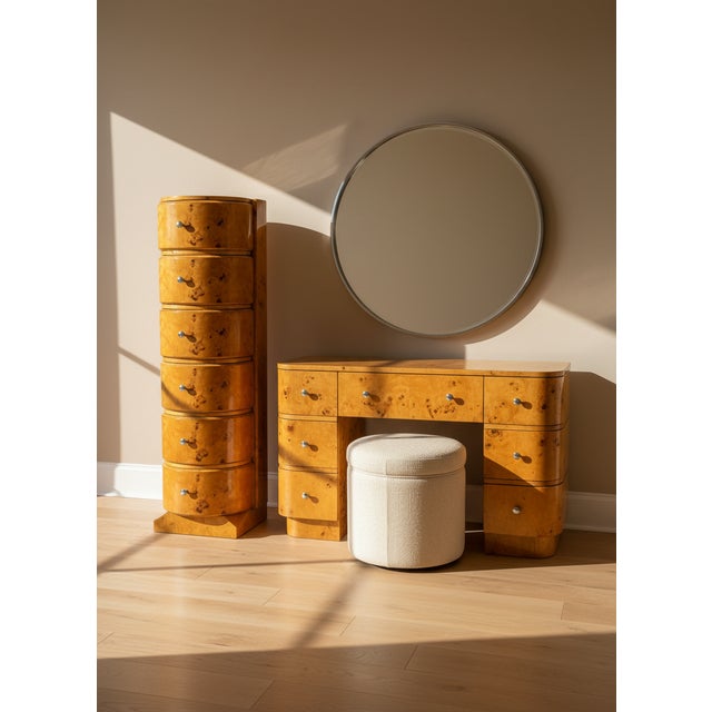 This a 6 drawer chest made of burl wood. The chest has a semi-circular shape wit chrome pulls. The base is plinth with a...