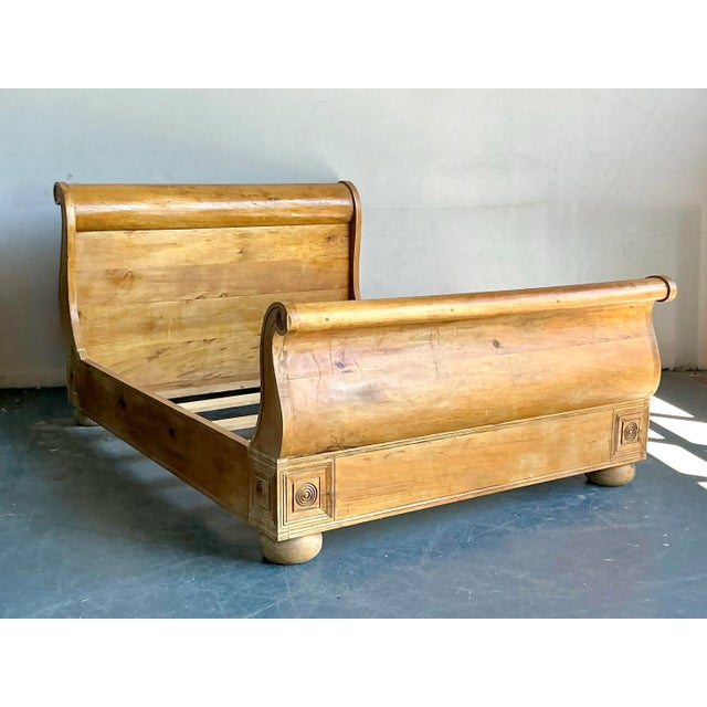 Embrace the relaxed elegance of this vintage Boho Chic queen sleigh bed, meticulously crafted from knotty pine. This bed...
