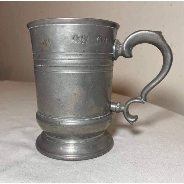 Up for sale is a rare antique 18th century handmade pewter pint beer mug. The mug is made out of thick pewter into a...