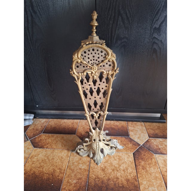 Peacock Tail Spark Shield in Bronze and Iron, 1960s, in Very Good conditions. Designed 1920 to 1949