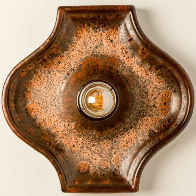 Beautiful set of red, green and brown ceramic wall lights in fat lava style. Manufactured in germany around the 1970s. The...