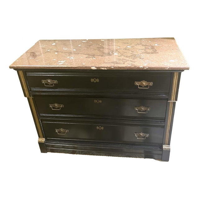 Vintage, Ebonized Wood Commode, Featuring a Marble Top, Three Drawers, Gilded Bronze Mounts, and Gilded Accents on Pilasters, in the Style of Eastlake For Sale