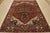 A traditional tribal Heriz rug hand-knotted with an all-wool pile on a cotton foundation. This oriental rug features a...