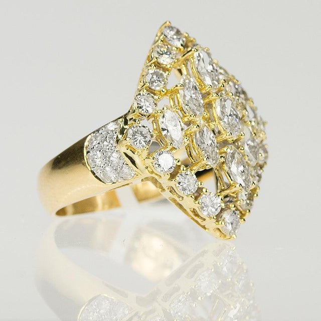 18k Cocktail ring with 9 marquis and 30 round diamonds weighing approximately 3.00 carats. 8.26 grams size 6.5