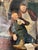 A charming antique European tavern scene oil painting depicting two elderly men sharing a quiet moment over a drink inside...
