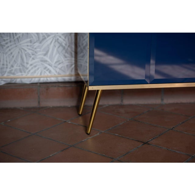 Two-door Italian sideboard designed and manufactured by Justfurnituress, with a birch wood structure, sapphire blue...