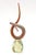 This vintage signed limited edition twisted glass sculpture are colors and shades of orange, to burnt orange with white...
