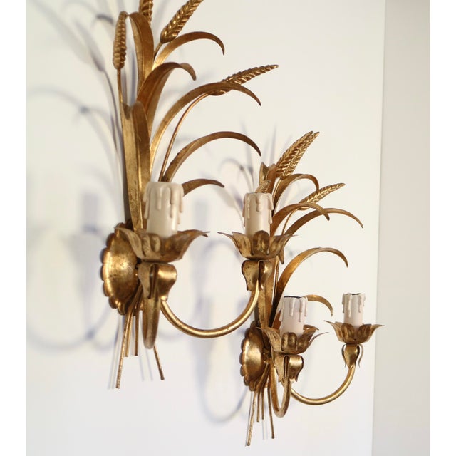 Pair of Hollywood Regency Italian gilded tole Sconces / Appliques with a wheat motive . Each one have two arms with two...