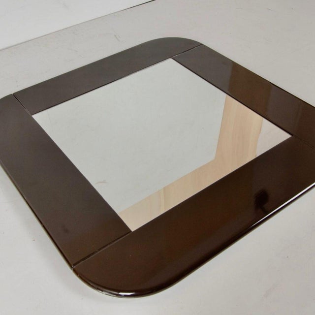 Mid-Century Modern Square Wall Mirror in Dark Brown Lacquered Wood – Italy, 1980s This Italian wall mirror that is an...