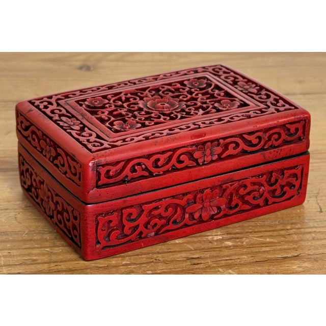 Vintage Chinoiserie style enamel box with intricately carved red exterior and black interior. The pop of red every room...