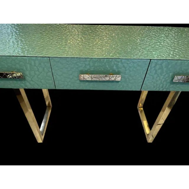 This console table represents an example of the highest quality craftsmanship, made entirely by hand using the renowned...