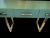 This console table represents an example of the highest quality craftsmanship, made entirely by hand using the renowned...