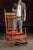 Antique oak spindle-back rocking chair with carved details. Featuring a tall spindle-back design, this piece offers...
