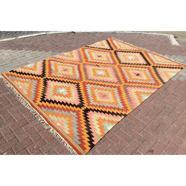 This beautiful, vintage, handwoven kilim is approximately 60 years old. It is handmade, of very fine quality hand spun...
