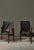 Beautiful pair of vintage "Safari" chairs in deeply patinated black leather and dark stained solid ash. Designed by Kaare...