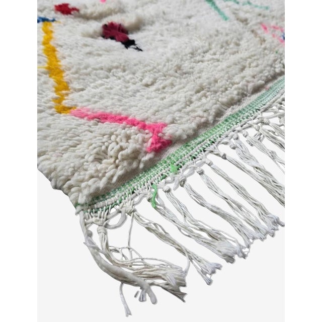 Handmade Azilal Carpet – Moroccan Berber Wool Rug This handmade Azilal carpet beautifully blends traditional Amazigh...