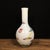 An elegant hand-painted opaque white glass vase, featuring a vivid double dragon chasing pearl design. The slender...