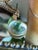 Vintage Accessocraft N.Y.C. gold tone lorgnette magnifier pendant necklace featuring a round clear glass lens suspended...