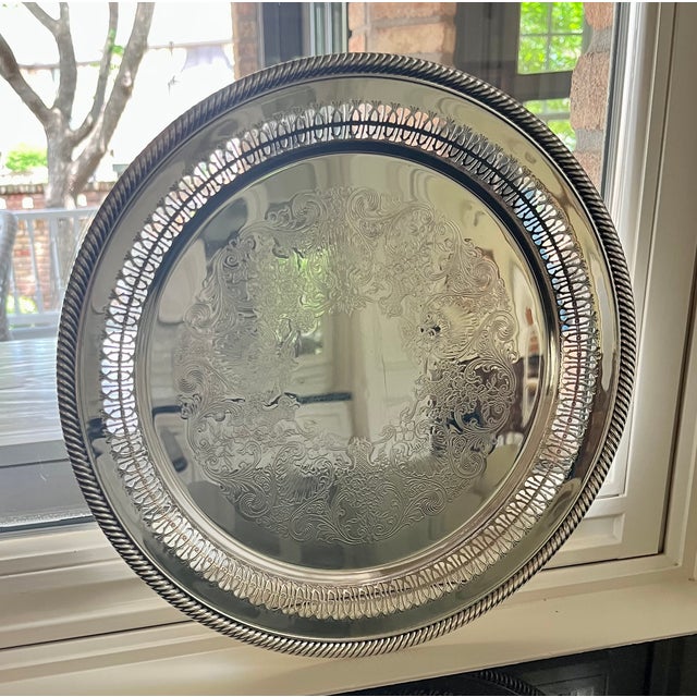 Recently this tray was almost black. It polished up well with some elbow grease. This round reticulated silver plate tray...