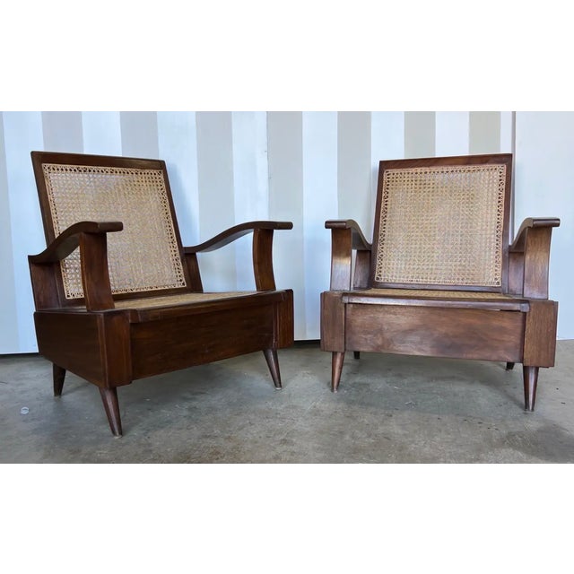 Great pair of deco period British colonial teak club chairs from the indies. Sleek and comfortable