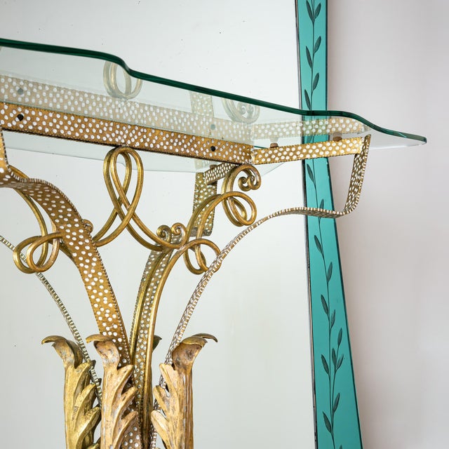 This impressive Italian wall mirror from the 1940s features a double trapezoidal shape and subtle floral etched decor on a...