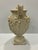 This large plaster urn features figures surrounding all sides. At 20.25 inches in height it has a strong sculptural...