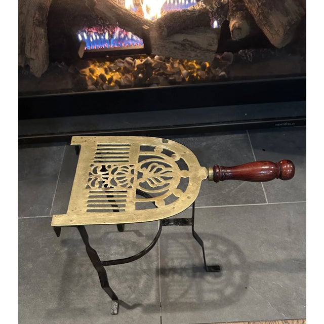 Early 19th century fireplace trivet, kettle warming stand, - solid brass and iron, - turned wood handle, - reticulated...