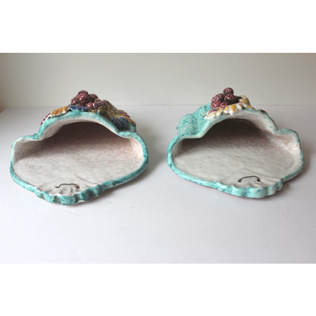 Fabulous pair of vintage Italian Majolica pottery wall pockets. The colours are so good - aqua blue, yellow, maroon. They...