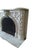 Substantial Victorian fireplace surround with arched aperture. Carved from muted Carrera marble with intricate and...