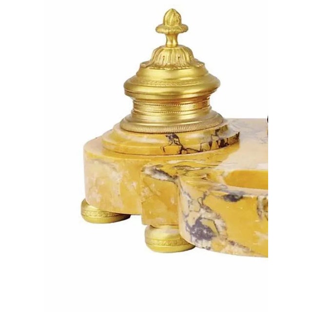 Important Napoleon III lion inkwell, 19th century In veined yellow Siena marble, centered with a lion's head with a long...