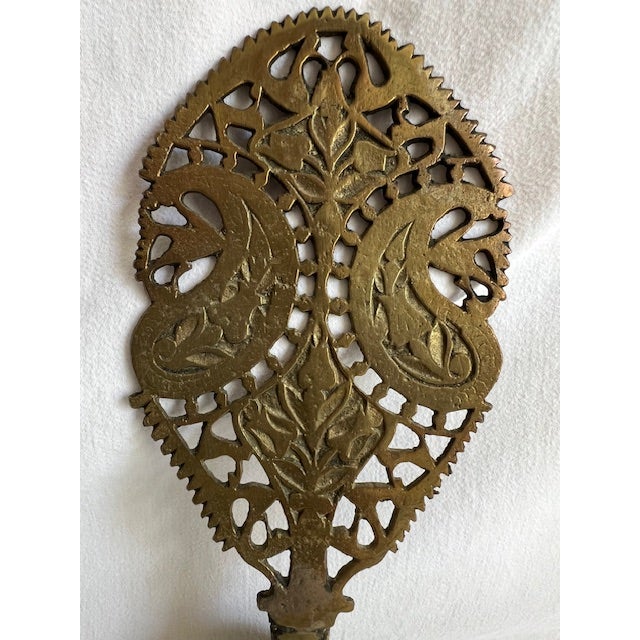 This is an antique Persian Qajar pierced brass serving spoon, likely a sherbert spoon, from the Qajar period (1795-1925)....