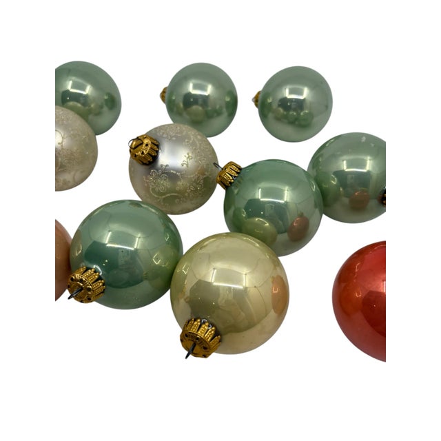 Vintage mercury glass ornaments made in west Germany. The glass ornaments are a mix of different colors and two ornament’s...