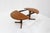 Vintage Danish round extendable dining table from the 1960s made of teak wood. This Danish dining table can be extended to...