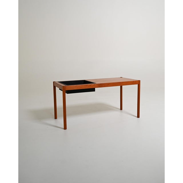 Teak bench with built-in planter. Scandinavian production, 1960s. Designed to house plants and decorative arrangements,...