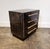 Four-drawer wood chest with black metal laminate base and modern pulls refinished by artist Lionel Lamy. Rich dark surface...